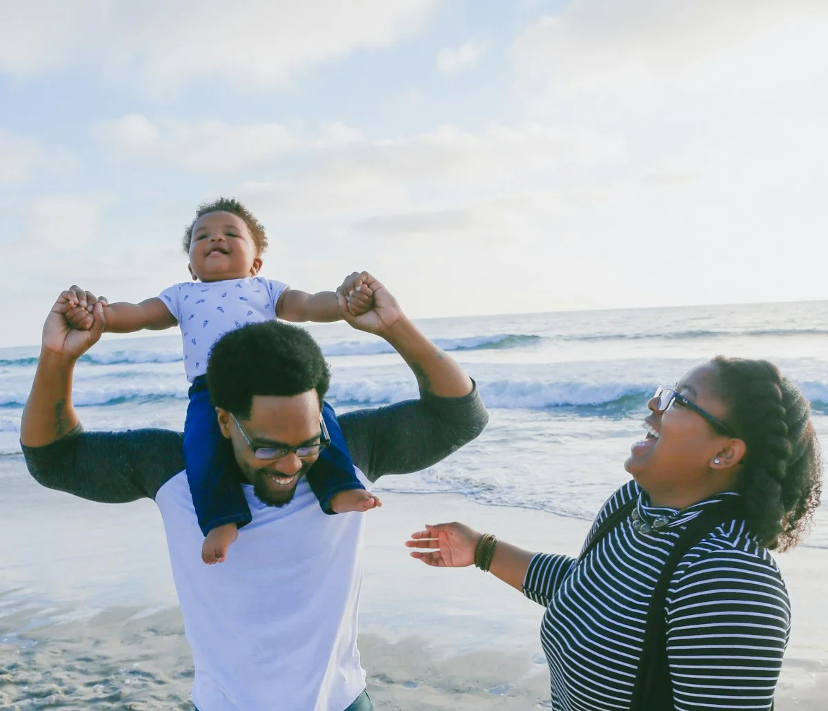Parents enjoying a day outdoors with their child
